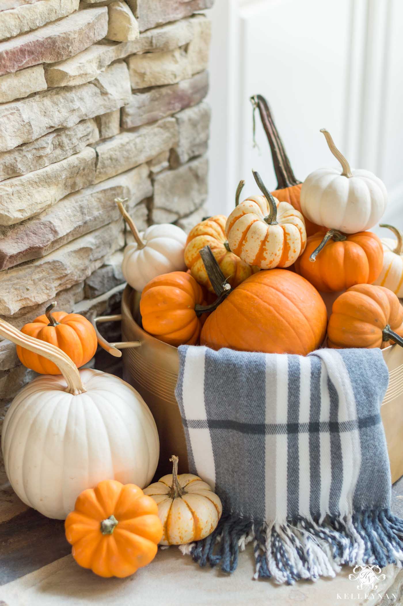 Fall home decor ideas with orange pumpkins and plaid