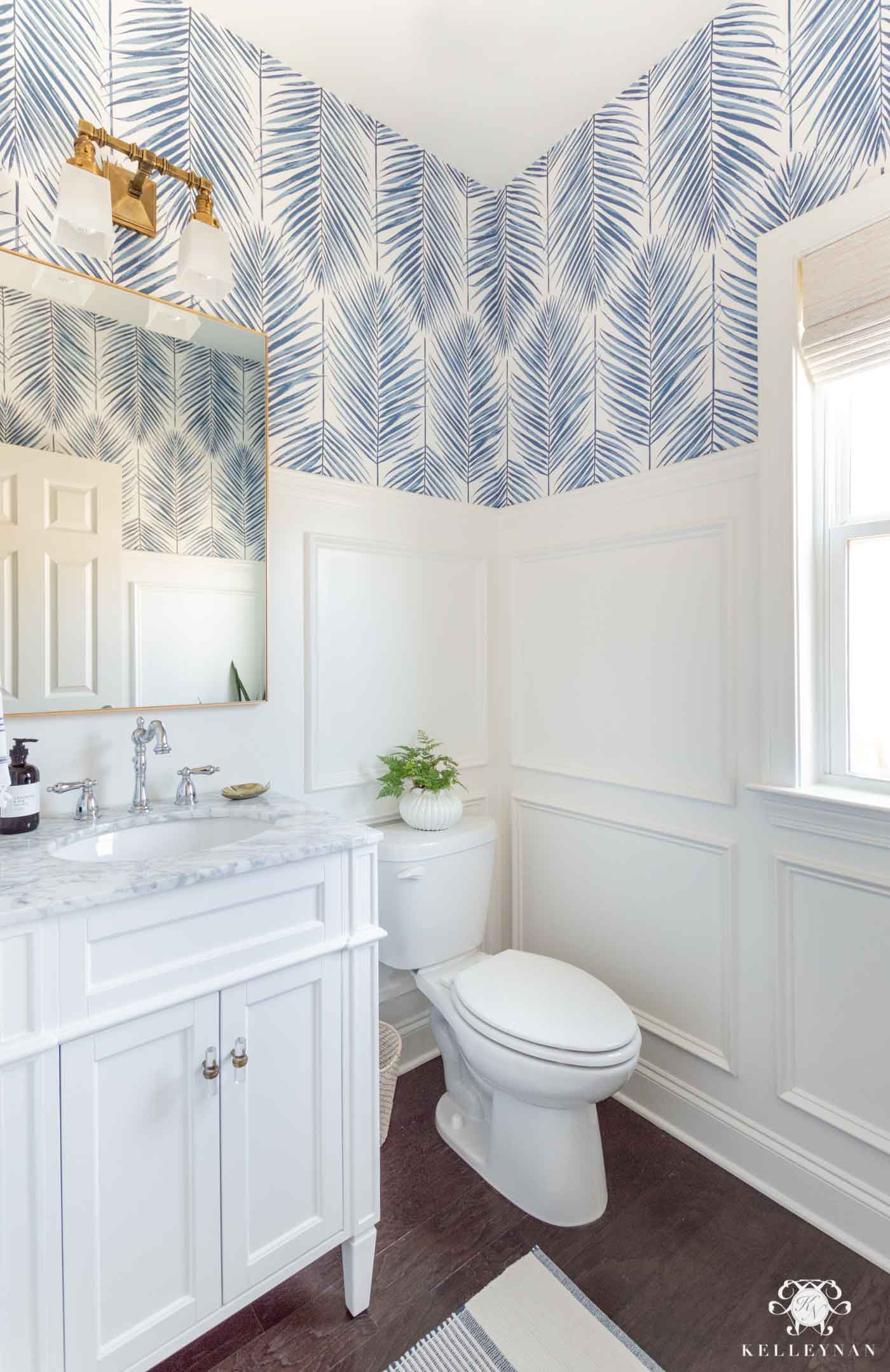 Powder Room Design Ideas in this Makeover Reveal, featuring picture frame moulding and blue palm wallpaper