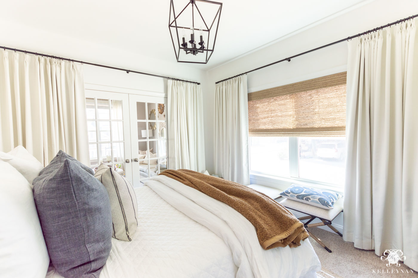 Privacy with Wall of Windows and Curtains in the Bedroom