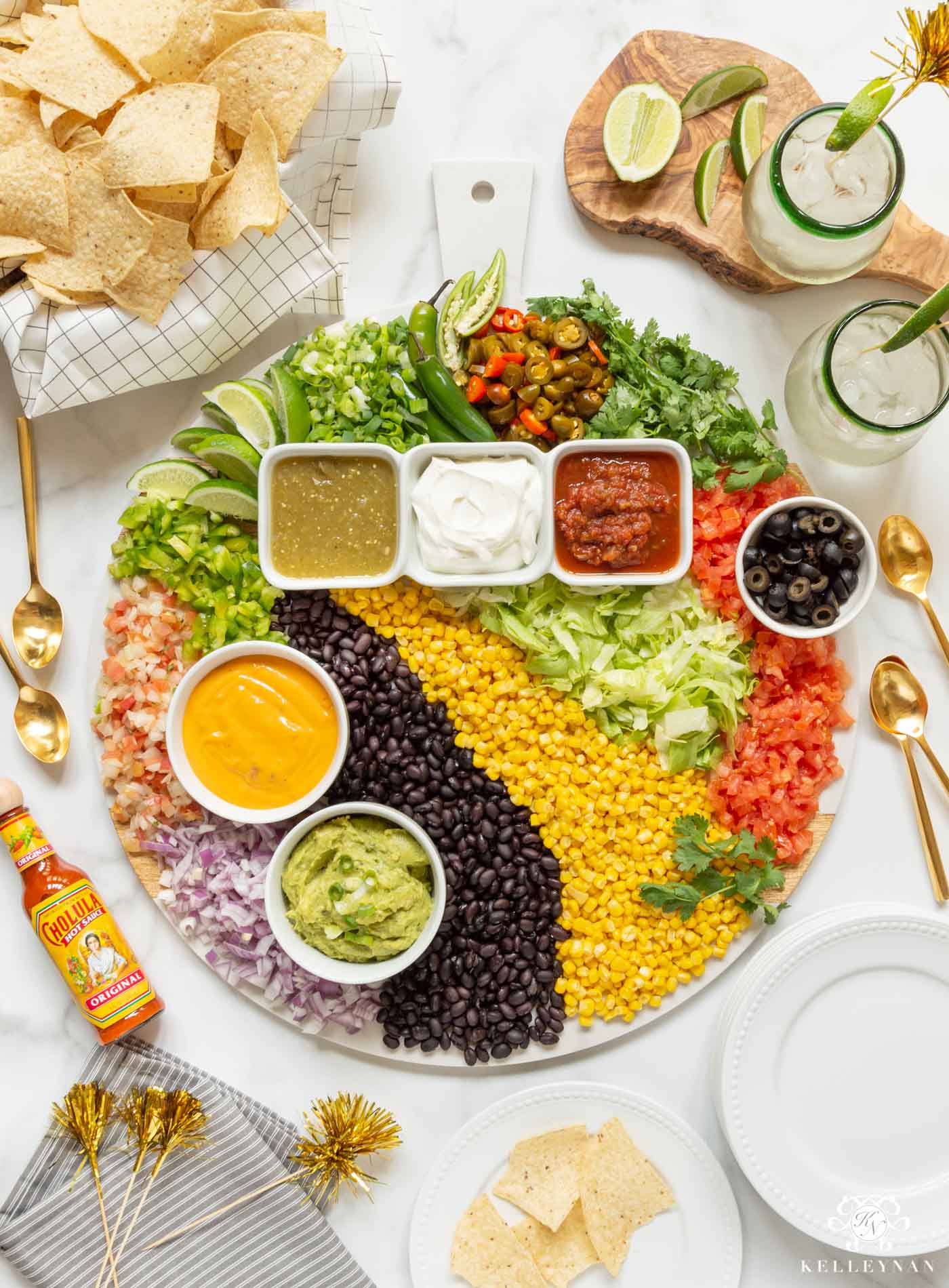 Make Your Own Nacho Bar -- The Perfect Mexican Nacho Board with Toppings and Sauces for your Next Mexican Fiesta!