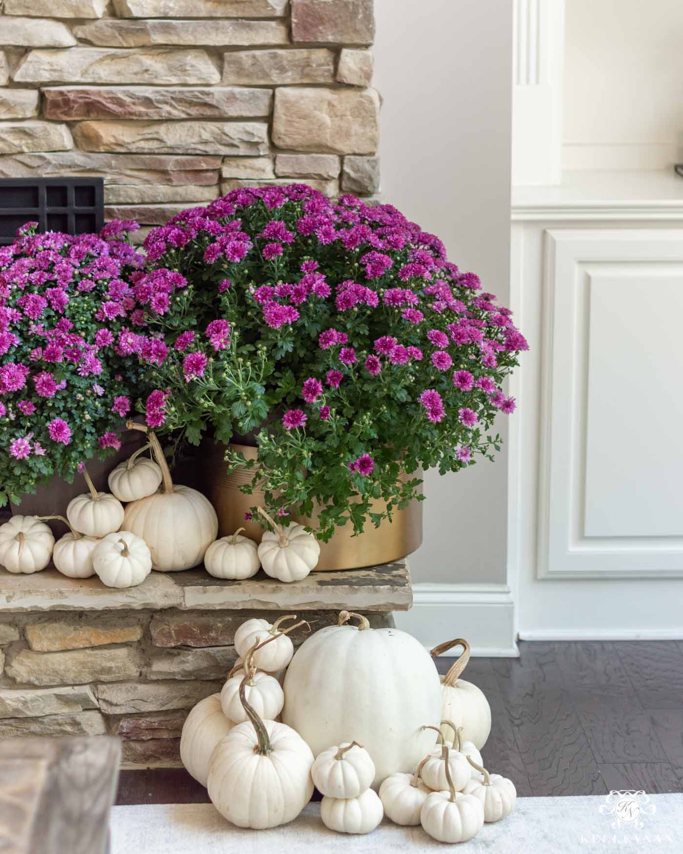 Fall Fireplace Decorating Ideas with White Pumpkins and Purple Mums