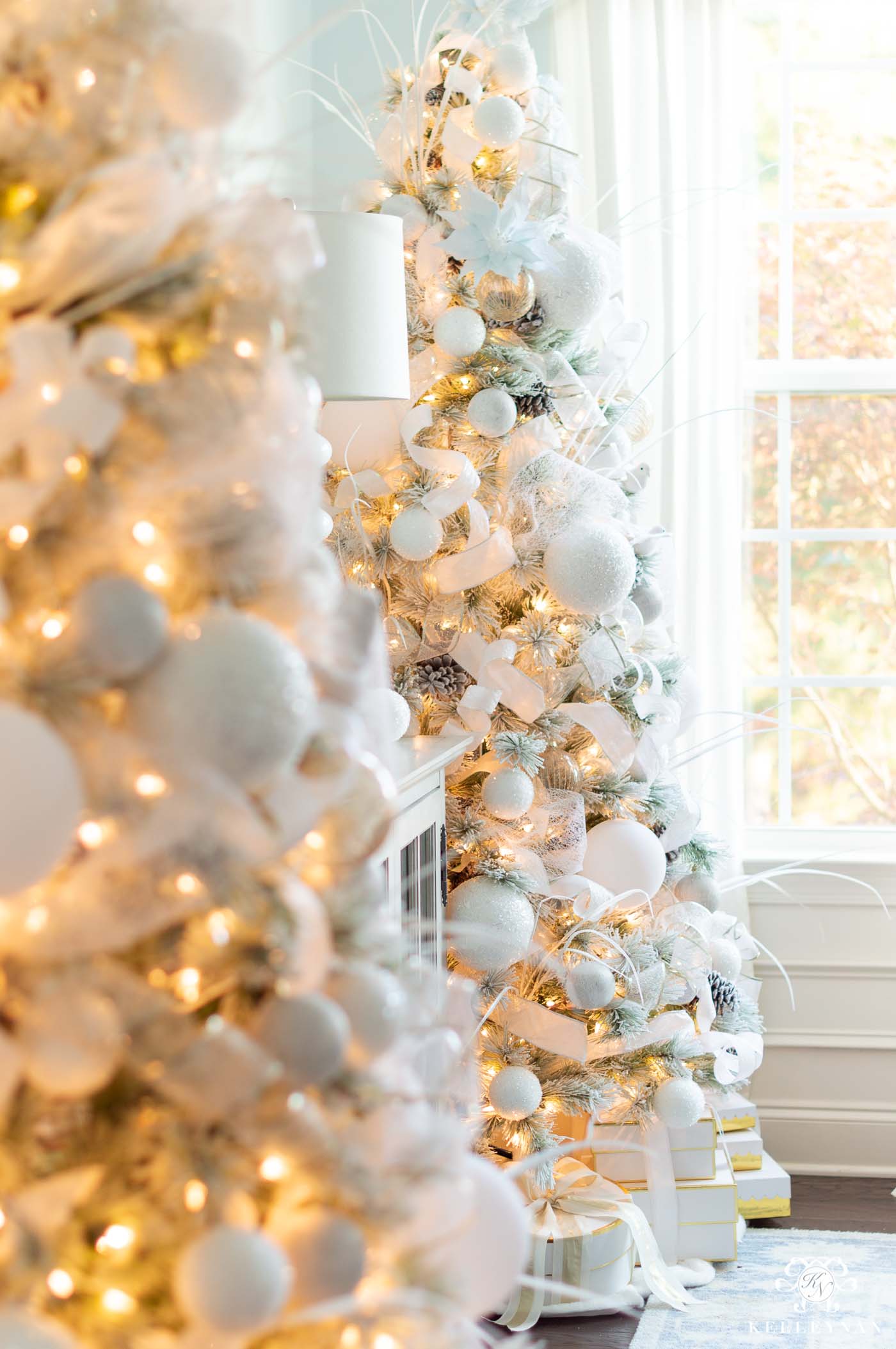 Elegant White Christmas Decor and Snowy Christmas Trees in the Dining Room