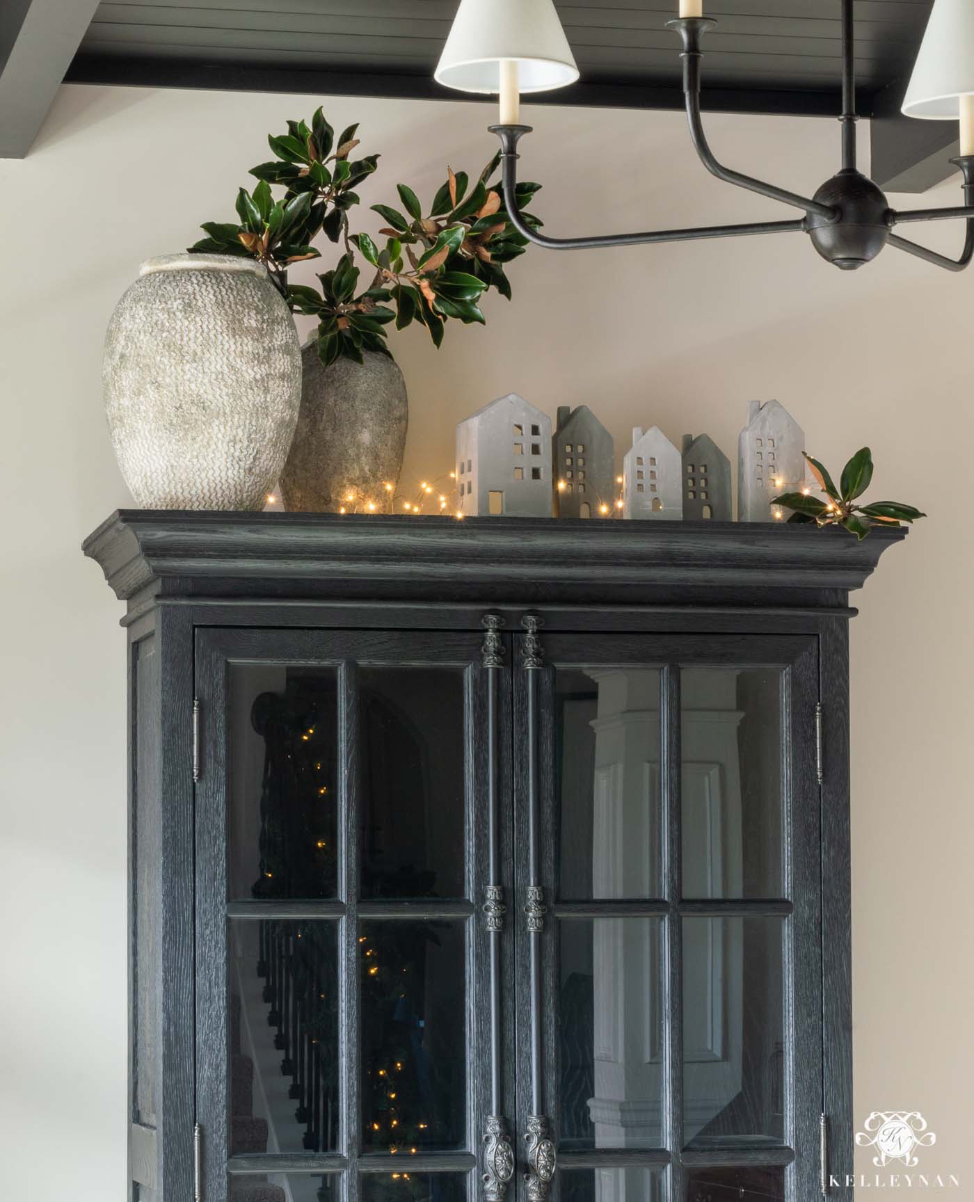 https://kelleynan.com/wp-content/uploads/2020/11/Modern-Black-Cabinet-Gray-House-Christmas-village.jpg