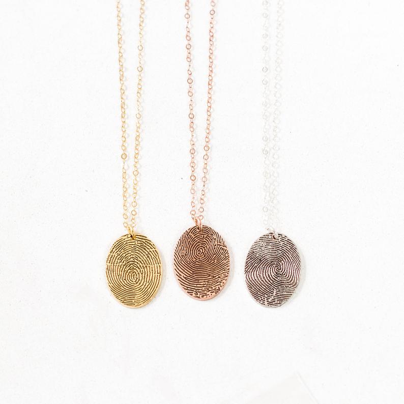 https://kelleynan.com/wp-content/uploads/2020/11/fingerprint-necklace.jpg