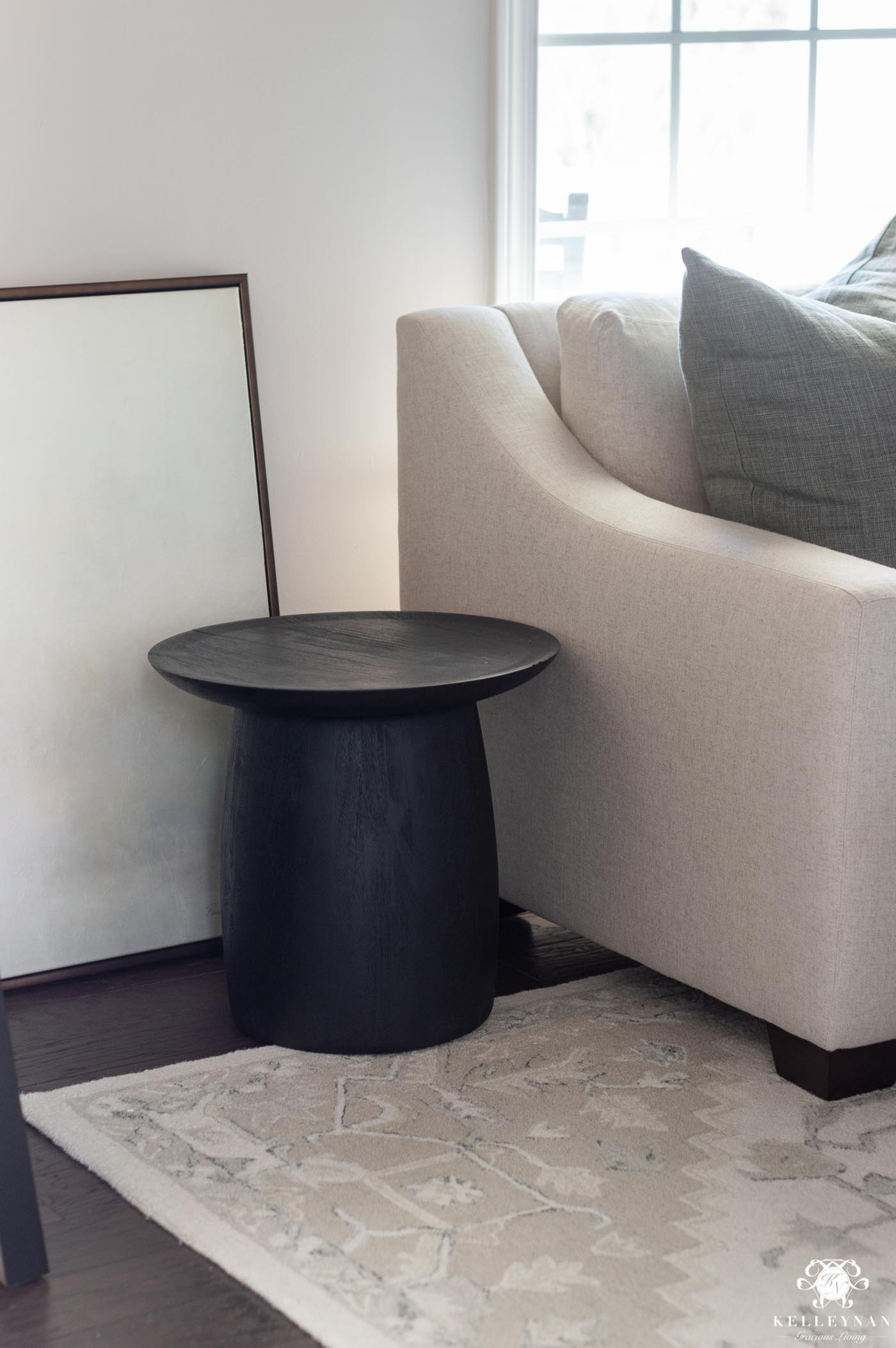 Black drum table as side table in the conversation room