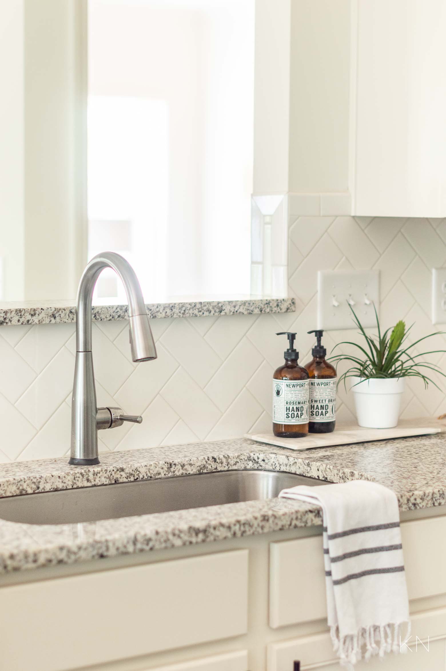 Updated Kitchen Faucet and Other Ways to Update a Builder Grade Kitchen