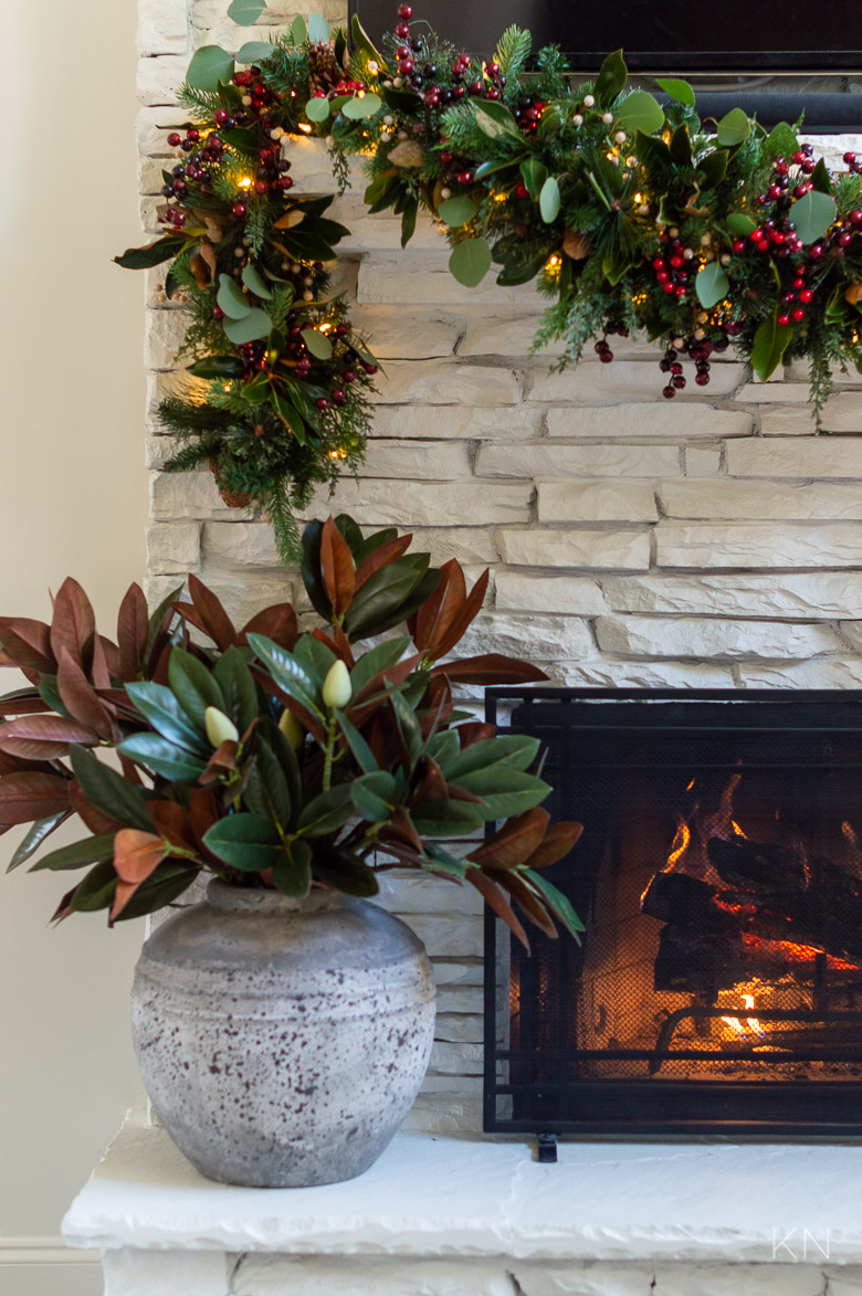 Magnolia Leaf Vase Arrangement on Christmas Fireplace Hearth