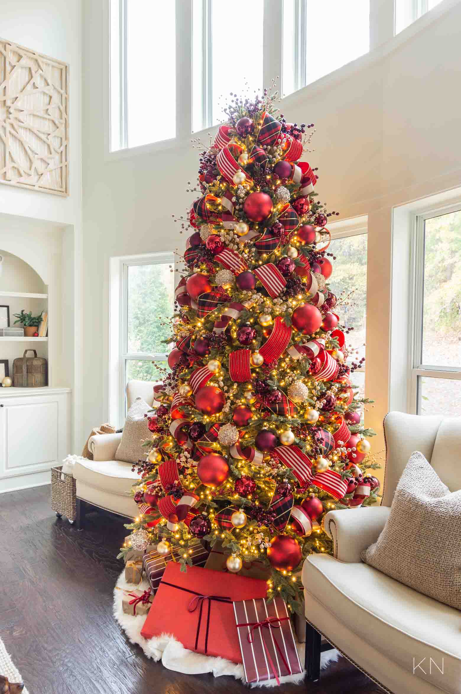 Red and Gold Christmas Tree in Front of Living Room Windows