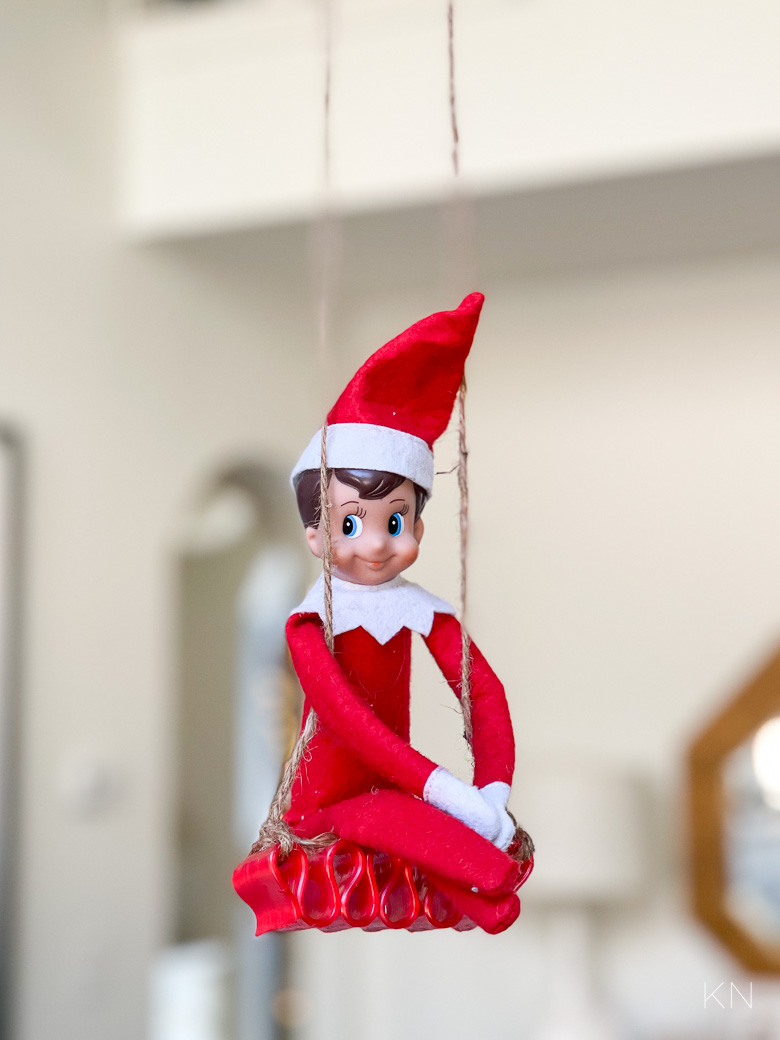 Elf on the Shelf Ideas -- Elf Swing on Chandelier Made of Candy