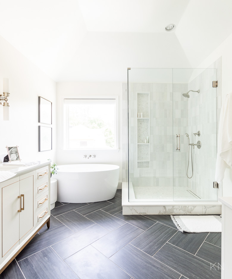 Primary Bathroom Remodel Ideas with White and Marble Shower and Black Tile Herringbone Floors