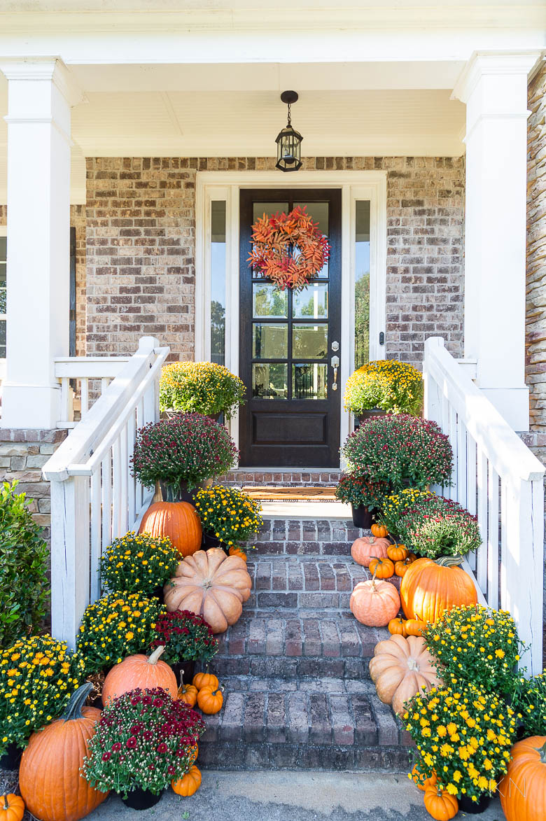 Fall Front Porch Steps Decor with Orange and Red Pumpkins and Mums