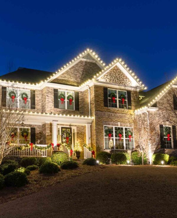 Christmas Wreaths On Windows with Red Bows and Lights